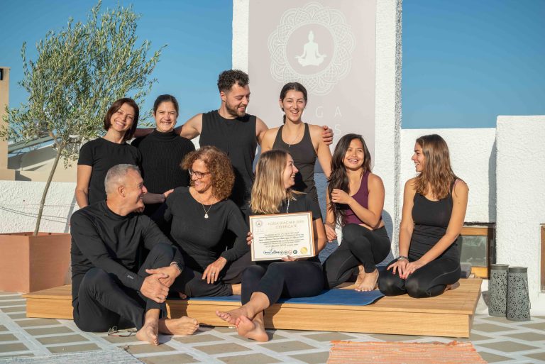 Celebratory photo of a group at Yoga Skyros Academy on the roof top in Athens